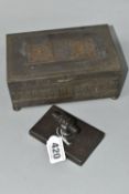 A WMF SILVERPLATE ON COPPER BOX AND A CAST METAL PAPERWEIGHT, the WMF box having a hinged cover