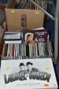 THREE BOXES OF CDS, LPS AND DVDS, comprising a twenty one piece boxed set of Laurel & Hardy DVDs,