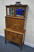 AN ARTS AND CRAFTS OAK MEDICAL / MEDICINE CABINET, labelled 'premier cabinet co', with an