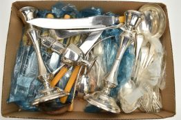 A PAIR OF SILVER CANDLESTICKS AND A SELECTION OF FLATWARE, the candlesticks of waisted design with