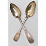 TWO GEORGIAN SILVER BASTING SPOONS, fiddle pattern spoons with engraved crests to the handle