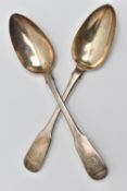 TWO GEORGIAN SILVER BASTING SPOONS, fiddle pattern spoons with engraved crests to the handle