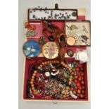 A BOX OF ASSORTED COSTUME JEWELLERY, a hinged jewellery box, encasing a selection of beaded