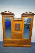 AN EDWARDIAN SATINWOOD COMPACTUM WARDROBE, with an arrangement of three cupboards with bevelled