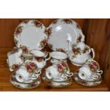 A TWENTY NINE PIECE ROYAL ALBERT OLD COUNTRY ROSES TEA SET, comprising a teapot, a cake plate, a