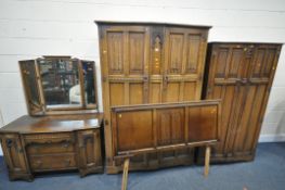 AN EARLY 20TH CENTURY OAK BEDROOM SUITE, comprising two sized wardrobes, largest wardrobe width