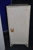 A VINTAGE METAL SINGLE DOOR WORKSHOP CABINET overpainted in cream with lock and one key width 57cm x
