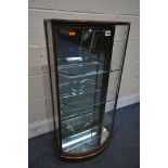 AN EARLY 20TH CENTURY MAHOGANY NARROW BOW FRONT DISPLAY CABINET, with a mirror back door, with 3