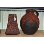 A GERMAN RED LAVA GLAZE DESIGN FLAGON, impressed Germany 990-30 on the base, together with a