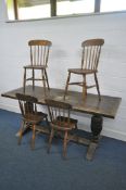 AN EARLY 20TH CENTURY OAK REFECTORY DINING TABLE, on twin acorn supports, united by a stretcher,