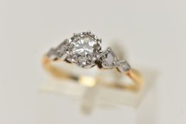 A YELLOW AND WHITE METAL SINGLE STONE DIAMOND RING, round brilliant cut diamond, illusion set,