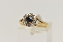 AN 18CT GOLD SAPPHIRE AND DIAMOND CLUSTER RING, of a circular form, set with a central circular