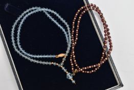 TWO GEM SET NECKLACES, the first desinged as a row of polished circular garnet beads, with yellow