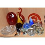 A GROUP OF COLOURED AND DECORATIVE GLASS WARES, to include a heavy red art glass vase, height