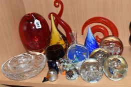 A GROUP OF COLOURED AND DECORATIVE GLASS WARES, to include a heavy red art glass vase, height