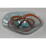 A LARGE OKRA GLASS DISH, blue and red design, inscribed on the base 2010, Ripple bowl, Richard