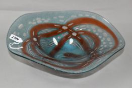 A LARGE OKRA GLASS DISH, blue and red design, inscribed on the base 2010, Ripple bowl, Richard
