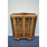 AN EARLY 20TH CENTURY WALNUT TWO DOOR CHINA CABINET, on ball and claw feet, width 101cm x depth 35cm