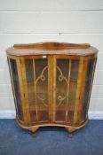 AN EARLY 20TH CENTURY WALNUT TWO DOOR CHINA CABINET, on ball and claw feet, width 101cm x depth 35cm