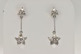 A PAIR OF 18CT WHITE GOLD DIAMOND DROP EARRINGS, each earring designed with a diamond set flower