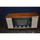 A VINTAGE EKCO ZODIAK VALVE RADIO in a walnut case (PAT fail due to uninsulated plug powers up and