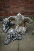 A WEATHERED COMPOSITE GARDEN FIGURE OF AN EAGLE, height 52cm, and two gargoyles garden figures (3)