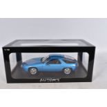 A BOXED AUTOART MILLENNIUM PORSCHE 928 1:18 MODEL VEHICLE, numbered 77901, MINERVA BLUE METALIC in