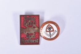 TWO GERMAN ENAMEL PIN BADGES., to include a Diene Hand Dem handwork pin badge, this is red and