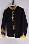 A PRE WWI STYLE MILITARY JACKET, the jacket is dark blue and yellow with gold colour brading