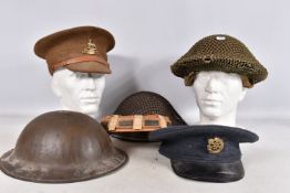 A SELECTION OF WWII ERA AND LATER MILITARY HATS, this lot includes a steel helmet dated 1940 with
