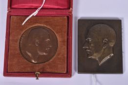 TWO GERMAN ADOLF HITLER PLAQUES, the first is round and comes in a fitted red case and features a