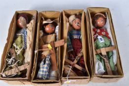 FOUR BOXED PELHAM SS COWBOY PUPPETS, all in different outfits, with a boxed Pelham SS Cowgirl puppet