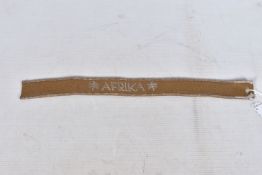 A WWII ERA GERMAN UNIFROM WRIST CUFF, this is one worn during the Afrika campaign and is brown