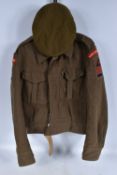 A WWII 1940 DATED BATTLE DRESS JACKET AND BERET, the jacket is a 1937 pattern blouse and dated