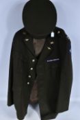 A US AIR FORCE JACKET AND PEAKED CAP, the jacket inner label says 54-H and manufacturer of KL, it