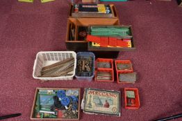 A WOODEN BOX AND ONE OTHER CONTAINING VINTAGE MECCANO PIECES, to include pieces in green, red,