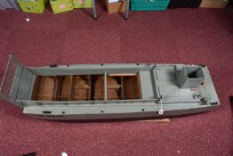 A MOTORISED WOODEN KIT BUILT MILITARY LANDING CRAFT MODEL, told by client has been out on water,