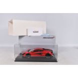 A BOXED TECNOMODEL EXCLUSIVE COLLECTION MCLAREN 570S 1:18 MODEL VEHICLE, numbered T18-EX02C, in
