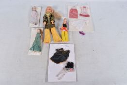 THREE UNBOXED PALITOY PIPPA DOLLS, with a small quantity of contemporary clothing and an unboxed
