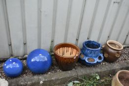 A SELECTION OF GLAZED GARDEN POTS, to include a plant pot, with floral decoration, diameter 38cm x