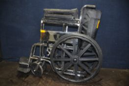 AN ACE EQUIPMENT FOLDING WHEELCHAIR with two footrests
