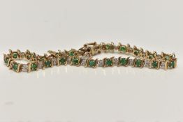 A 9CT GOLD EMERALD AND DIAMOND LINE BRACELET, alternating circular cut emeralds and single cut