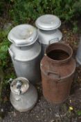 THREE GALVANISED MILK CHURNS, height 74cm, and another smaller churn (condition - one milk churn