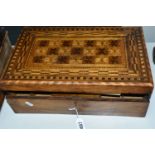 A MARQUETRY WRITING SLOPE, with star quilt-like design to top, green baize writing surface, roller