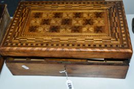 A MARQUETRY WRITING SLOPE, with star quilt-like design to top, green baize writing surface, roller