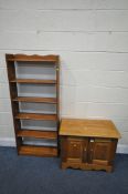 A PINE TWO DOOR CABINET, width 76cm x depth 41cm x height 58cm, along with a slim bookcase (