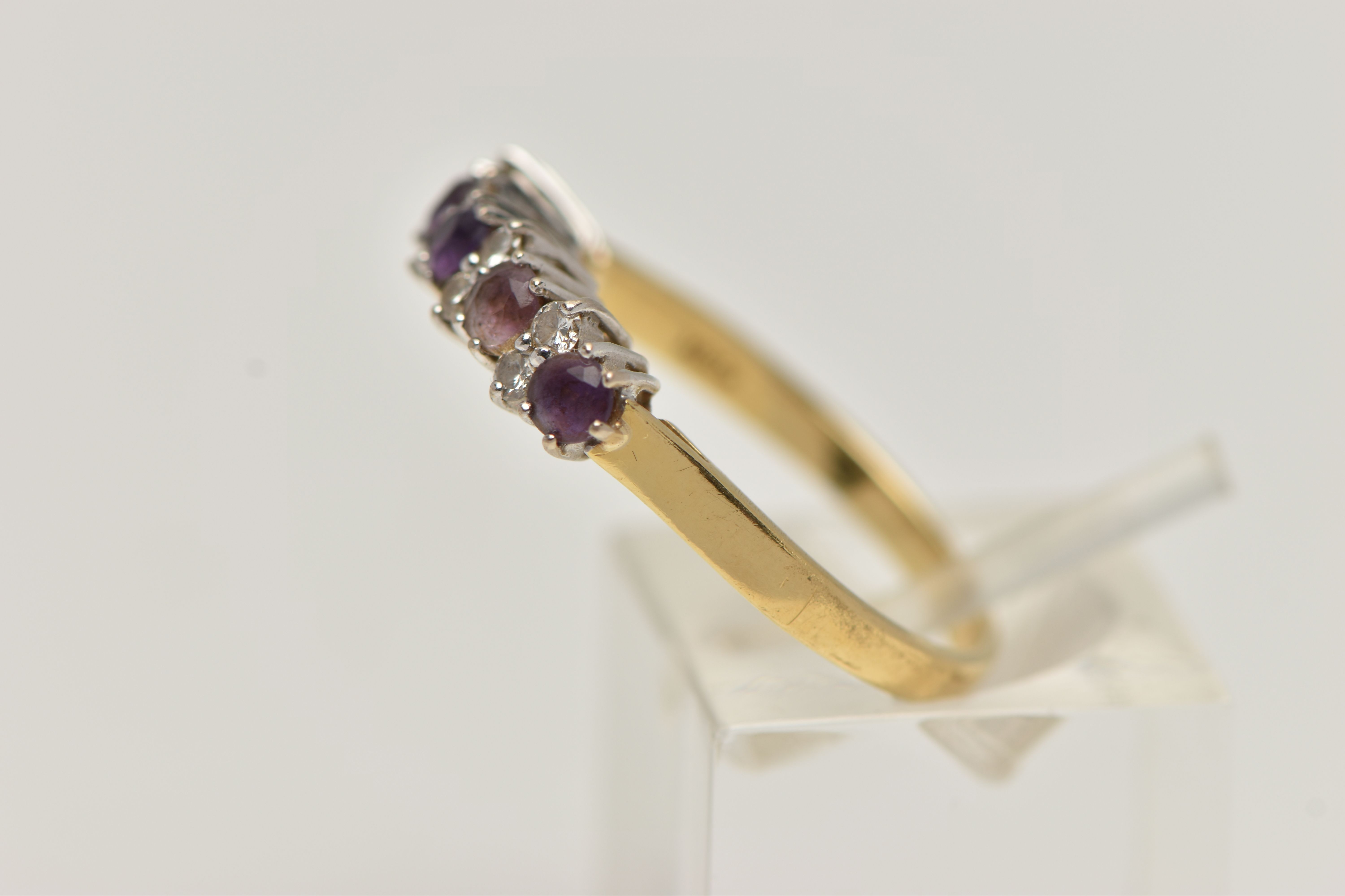 A 18CT GOLD DIAMOND AND AMETHYST RING, five circular cut amethyst stones interspaced with round - Image 2 of 4