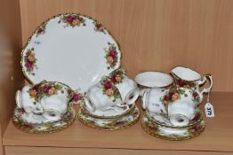 A TWENTY ONE PIECE ROYAL ALBERT OLD COUNTRY ROSES TEA SET, comprising a cake plate, a cream jug, a