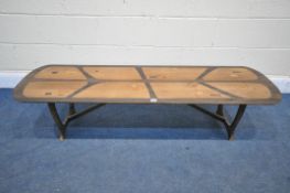 A MID CENTURY HEALS LONG TOM COFFEE TABLE, by Everest, on trestle legs united by a stretcher,