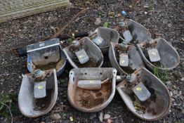 NINE GALVANISED CATTLE DRINKING BOWLS, seven labelled 'Burgess LTD Stafford' and a pair of horse